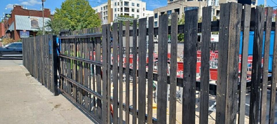 Custom Fence - cedar boards over steel frame - Tin Roof Restaurant - Fayetteville, Arkansas